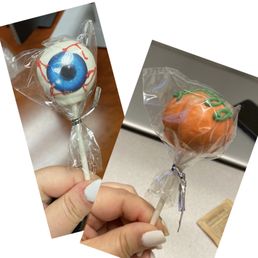 a hand holding a lollipop a hand holding a lollipop