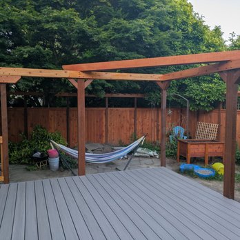 Riggins Construction - Composite deck, super strong arbor, fence with trellis in background - Fences & Gates Near Me - Seattle, Washington Riggins Construction - Composite deck, super strong arbor, fence with trellis in background - Fences & Gates Near Me - Seattle, Washington