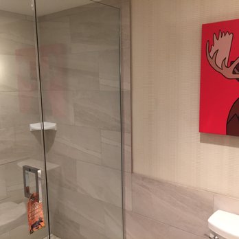 Moose Hotel & Suites - The bathroom - with some great artwork. - Hotels Near Me - Banff, Alberta Moose Hotel & Suites - The bathroom - with some great artwork. - Hotels Near Me - Banff, Alberta