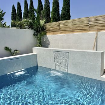 Waterfall Pools - Modern waterfall with aqua white mini pebble finish - Pool & Hot Tub Service Near Me Waterfall Pools - Modern waterfall with aqua white mini pebble finish - Pool & Hot Tub Service Near Me