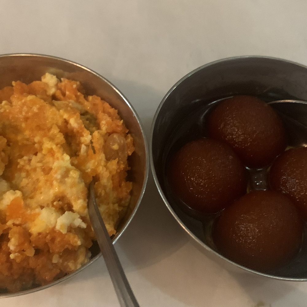 Carrot halwa and gulab jamun. Both are sweet and yummy. Carrot halwa and gulab jamun. Both are sweet and yummy.