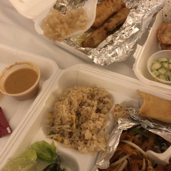 Pad Thai - A long black hair within the fried rice where both pics show it being pulled out from within, plus watered down peanut sauce - Thai Near Me - Santa Ana, California