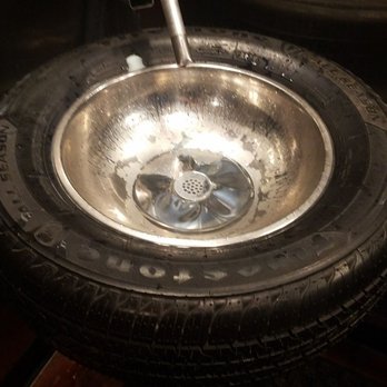 Ford's Garage Dearborn - The sink in the bathroom. A tire as the sink with a gas station pump nozzle as the faucet. So cool! - Burgers Near Me - Dearborn, Michigan