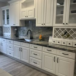 Iconic Floors & More - Antique White Shaker Cabinets with Quartz Countertops.