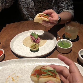 Manta - 1 fish taco and 2 Cochinita Pibil steamed buns (left to right). Each individual portions from the 5-course tasting menu. - Mexican Near Me - Cabo San Lucas, BCS Manta - 1 fish taco and 2 Cochinita Pibil steamed buns (left to right). Each individual portions from the 5-course tasting menu. - Mexican Near Me - Cabo San Lucas, BCS