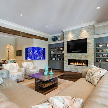 Hessler Floor Covering - a living room with couches and a fireplace - Carpeting Near Me - Naples, Florida Hessler Floor Covering - a living room with couches and a fireplace - Carpeting Near Me - Naples, Florida