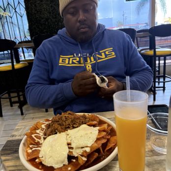 A Huevo Cafe - He enjoyed his birria chilaquiles. They were massive. - Breakfast & Brunch Near Me - Los Angeles, California