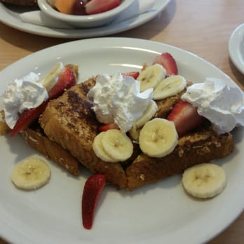 Sunny Street Cafe - The French Toast Crunch topped with bananas and whipped cream! - Breakfast & Brunch Near Me - Dublin, Ohio Sunny Street Cafe - The French Toast Crunch topped with bananas and whipped cream! - Breakfast & Brunch Near Me - Dublin, Ohio