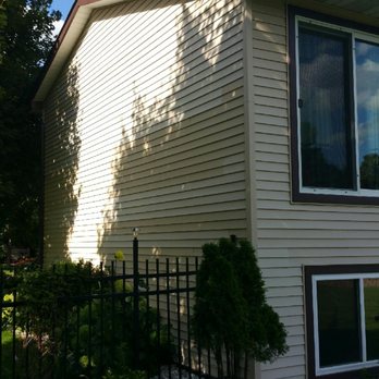 T&D General Contractor - a house with a metal fence - General Contractors Near Me - Minneapolis, Minnesota