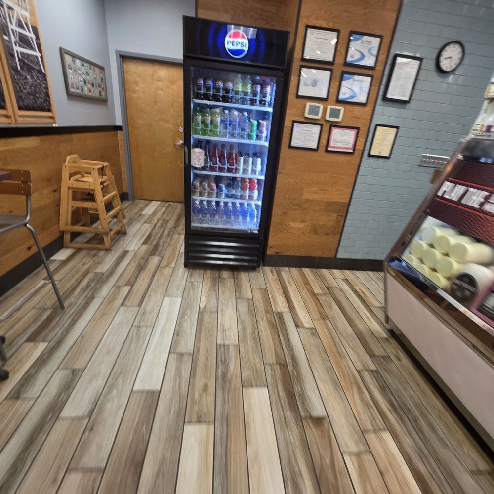 Jersey Mike's Subs - View from the front entrance going towards the restrooms and ordering counter. - Fast Food Near Me - Kennesaw, Georgia Jersey Mike's Subs - View from the front entrance going towards the restrooms and ordering counter. - Fast Food Near Me - Kennesaw, Georgia