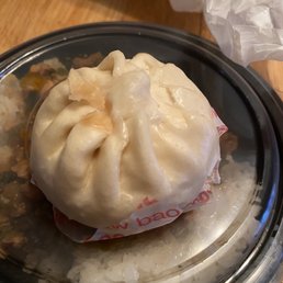 a dumpling on a plate with rice a dumpling on a plate with rice