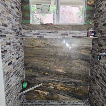 VersaTile - Accent wall slab side walls 3x12 shower pan with lineal drain. - Flooring Near Me - Gardnerville, Nevada