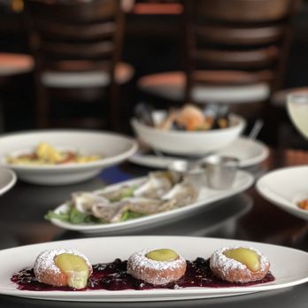 Bocca - plates of food on a table in a restaurant - Italian Near Me - Indianapolis, Indiana Bocca - plates of food on a table in a restaurant - Italian Near Me - Indianapolis, Indiana