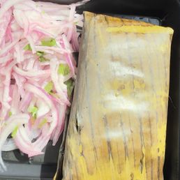 Tamal and onions  Tamal has no price listing and this is the combo/meal. No drink or rice and now beans or anything.
