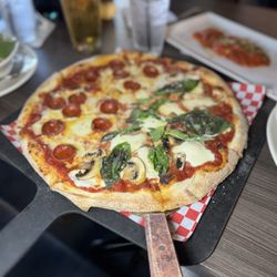 Dovini Italian Bar & Grill - Half pepperoni, half margarita with mushrooms