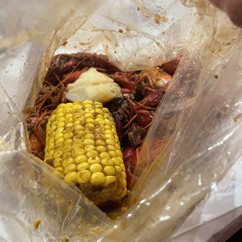LA Crawfish - a corn on the cob in a plastic bag - Cajun/Creole Near Me - Richmond, Texas LA Crawfish - a corn on the cob in a plastic bag - Cajun/Creole Near Me - Richmond, Texas