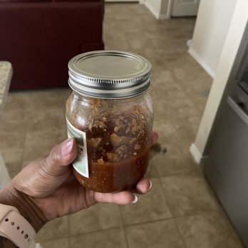 Nanny Goat Salsa - a hand holding a jar of food - Specialty Food Near Me - Elgin, Texas