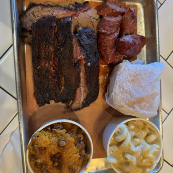 Mighty Quinn's Barbeque - Three meat combo: Sausage, ribs and sliced brisket. Sides Mac and cheese, mashed sweet potato and cornbread - Barbeque Near Me - Tampa, Florida Mighty Quinn's Barbeque - Three meat combo: Sausage, ribs and sliced brisket. Sides Mac and cheese, mashed sweet potato and cornbread - Barbeque Near Me - Tampa, Florida