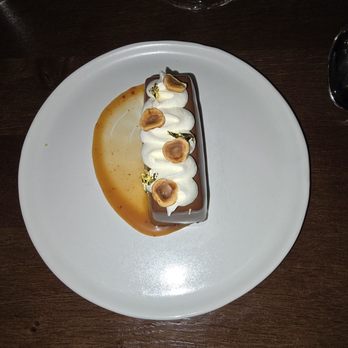 L’Ostrica - The dessert: a wonderful chocolate mousse bar with caramel sauce, whipped cream, toffee chips, and gold leaf toppings. Amazing! - Tasting Classes Near Me - Charlotte, North Carolina