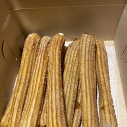 La Casa del Churro Cafe - Churros filled with strawberry, vanilla, cream cheese, cajeta, and chocolate