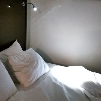 GuestHouse Inn & Suites - Olympic Inn & Suites bedlamp. There are 2 per bed. Bed's messy because I slept in it. Pretty comfy. - Hotels Near Me - Aberdeen, Washington