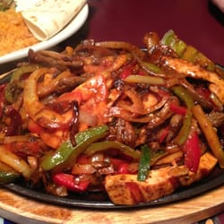 Que Mas Mexican Cafe - Chicken and steak fajita combo! And it was sizzling!!