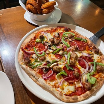 Stoney's - a pizza with pepperoni, onions, mushrooms, and cheese - Bars Near Me - Washington, DC, District of Columbia