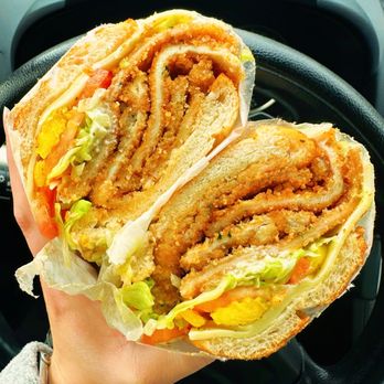 Claudia's Grinder Shop - Chicken cutlet grinder with lettuce, mayo, tomato, and banana peppers. - Delis Near Me - Farmington, Connecticut