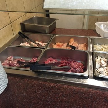 Mings Buffet & Grill - Raw meat laying out at "hibachi grill" notice only one set of tongs for chicken, and beef and whatever else that is. - Chinese Near Me - McMinnville, Tennessee