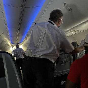 American Airlines - The butthole who demanded everyone in the exit row produce a ticket.  Yeah, he was embarrassed when everyone did... - Airlines Near Me - Miami, Florida