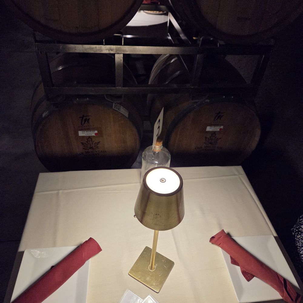Cave Restaurant - Table setting; tables separated by wine barrels - Venues & Event Spaces Near Me - Temecula, California