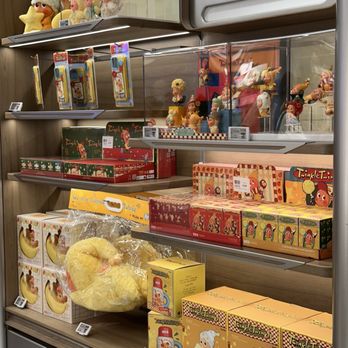 Pop Mart - A retail store shelf features Twinkle Tink merchandise, plush toys, and collectible figures, with some items in clear display cases. - Toy Stores Near Me - Arcadia, California