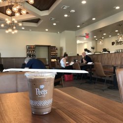 Peet's Coffee - Diagonal photo showing booth seating with counter in background