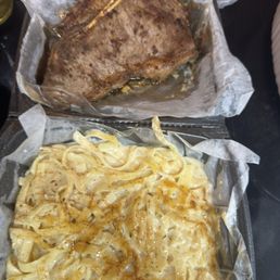 Dry overcooked steak and pasta with no seasoning.