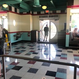 a man walking through a door a man walking through a door