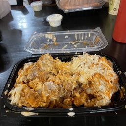 Half demolished Kikis Tots (with Chicken) and extra Cheese