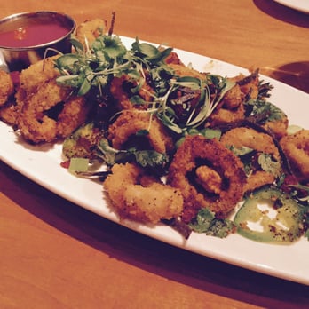 The Cellar - Appetizer: Calamari served on various greens and peppers with a marinara sauce. - Tapas Bars Near Me - Corning, New York The Cellar - Appetizer: Calamari served on various greens and peppers with a marinara sauce. - Tapas Bars Near Me - Corning, New York