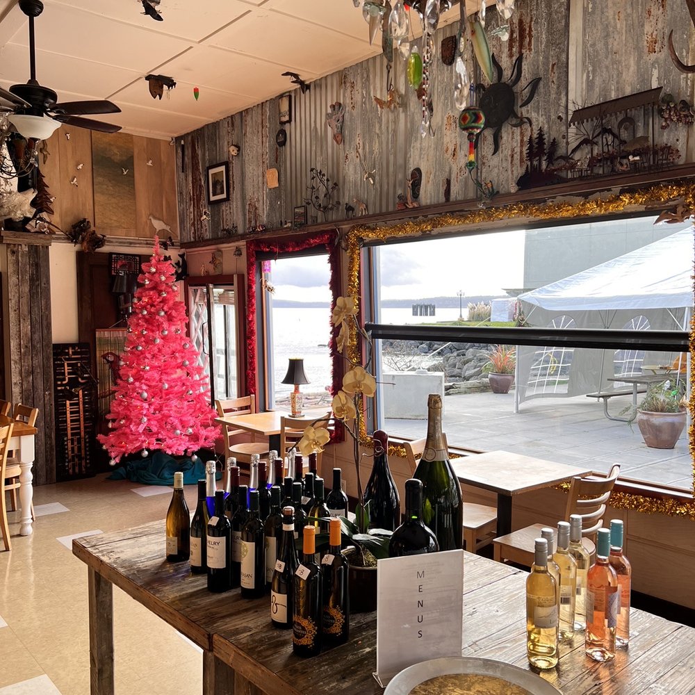 a table with bottles of wine on it a table with bottles of wine on it
