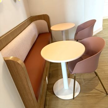 Zero Gradi - a corner seating area with a table and chairs - Gelato Near Me - Mckinney, Texas