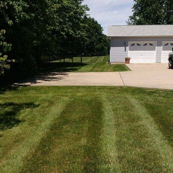 Clean Cuts Lawn Care - a truck parked in front of a house - Landscaping Near Me Clean Cuts Lawn Care - a truck parked in front of a house - Landscaping Near Me