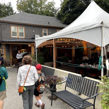 Krista's - The entrance of Krista's - outdoor dining is available and they have a few couches/tables for people waiting for their reservations. - New American Near Me - Cornish, Maine
