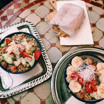 Pause Cafe - Green bowl (left), matcha green tea (right) and half egg tomato onion avocado sandwich - Moroccan Near Me - New York, New York Pause Cafe - Green bowl (left), matcha green tea (right) and half egg tomato onion avocado sandwich - Moroccan Near Me - New York, New York