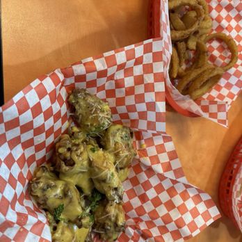 Level Up Burgers - Garlic parm wings fried hard and onion rings - Burgers Near Me - Lakewood, Washington Level Up Burgers - Garlic parm wings fried hard and onion rings - Burgers Near Me - Lakewood, Washington