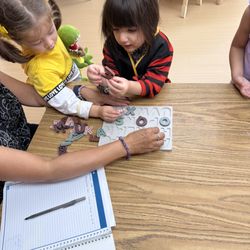 Foxberry Preschool - Ms. Jackie is conducting student assessment. We partner with parents to support each student's grow.