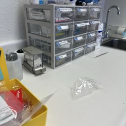 Hawaiian Island Dental - Supplies in the back of an examination room.