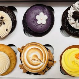 Sugarlina Bakeshop cupcakes: starting from top left to chocolate vanilla, ube, cookies and cream, salted caramel, s'mores, mango lilikoi