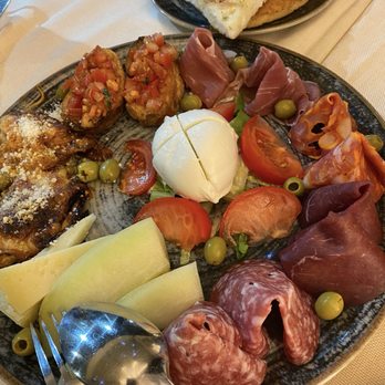 Melarancio - The full antipasto plate before we dug in with the side of Focaccia bread. - Wine Bars Near Me - Rome, RM Melarancio - The full antipasto plate before we dug in with the side of Focaccia bread. - Wine Bars Near Me - Rome, RM