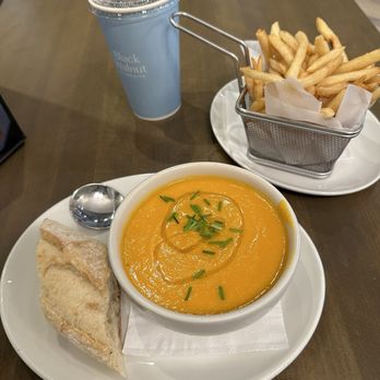 Black Walnut - Carrot and ginger soup with a side of fries - New American Near Me - Houston, Texas