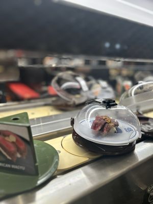 Kura Revolving Sushi Bar by null