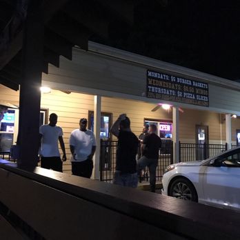 Owlz Pub - people standing outside at night - Sports Bars Near Me - Kennesaw, Georgia Owlz Pub - people standing outside at night - Sports Bars Near Me - Kennesaw, Georgia